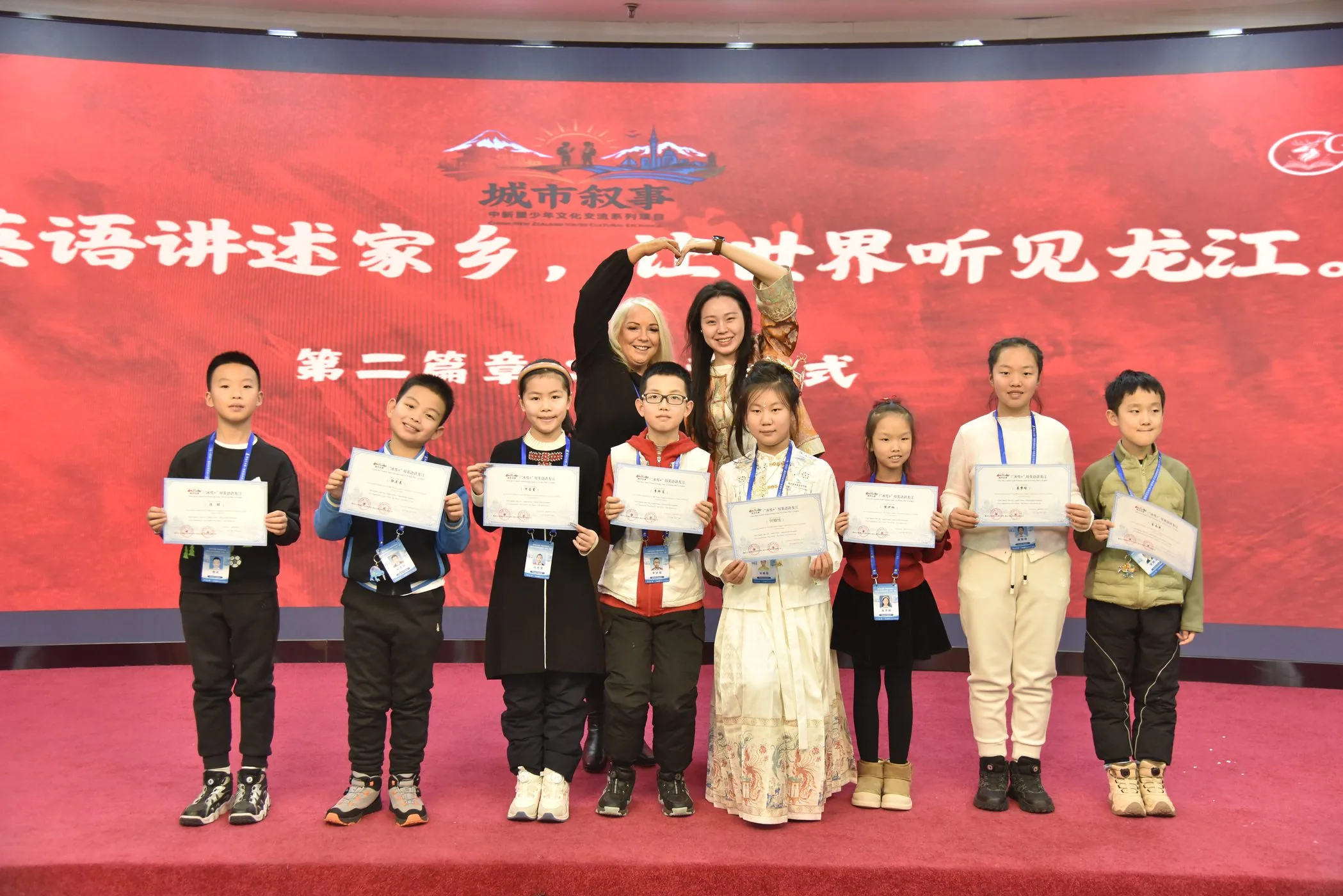 Students receiving certificates at closing showcase