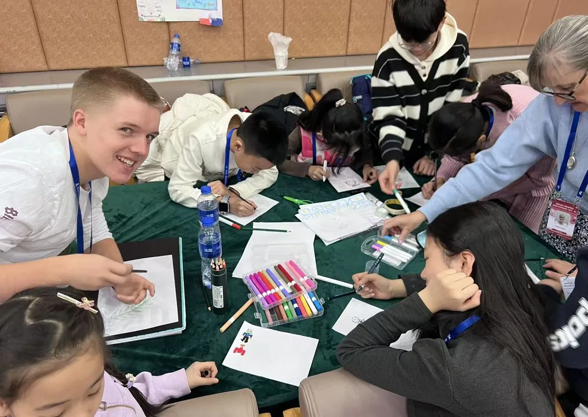Students and international buddies collaborating in class