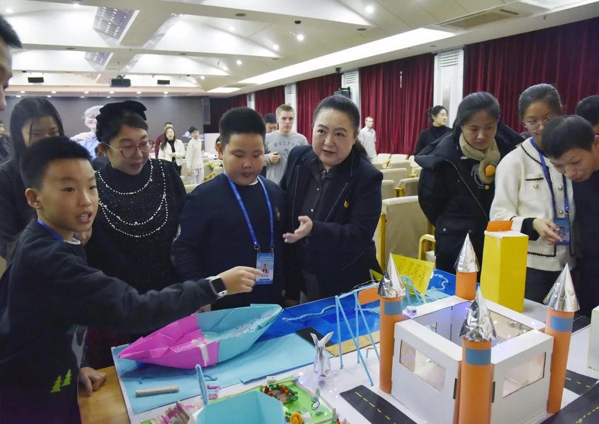 Students presenting a project model